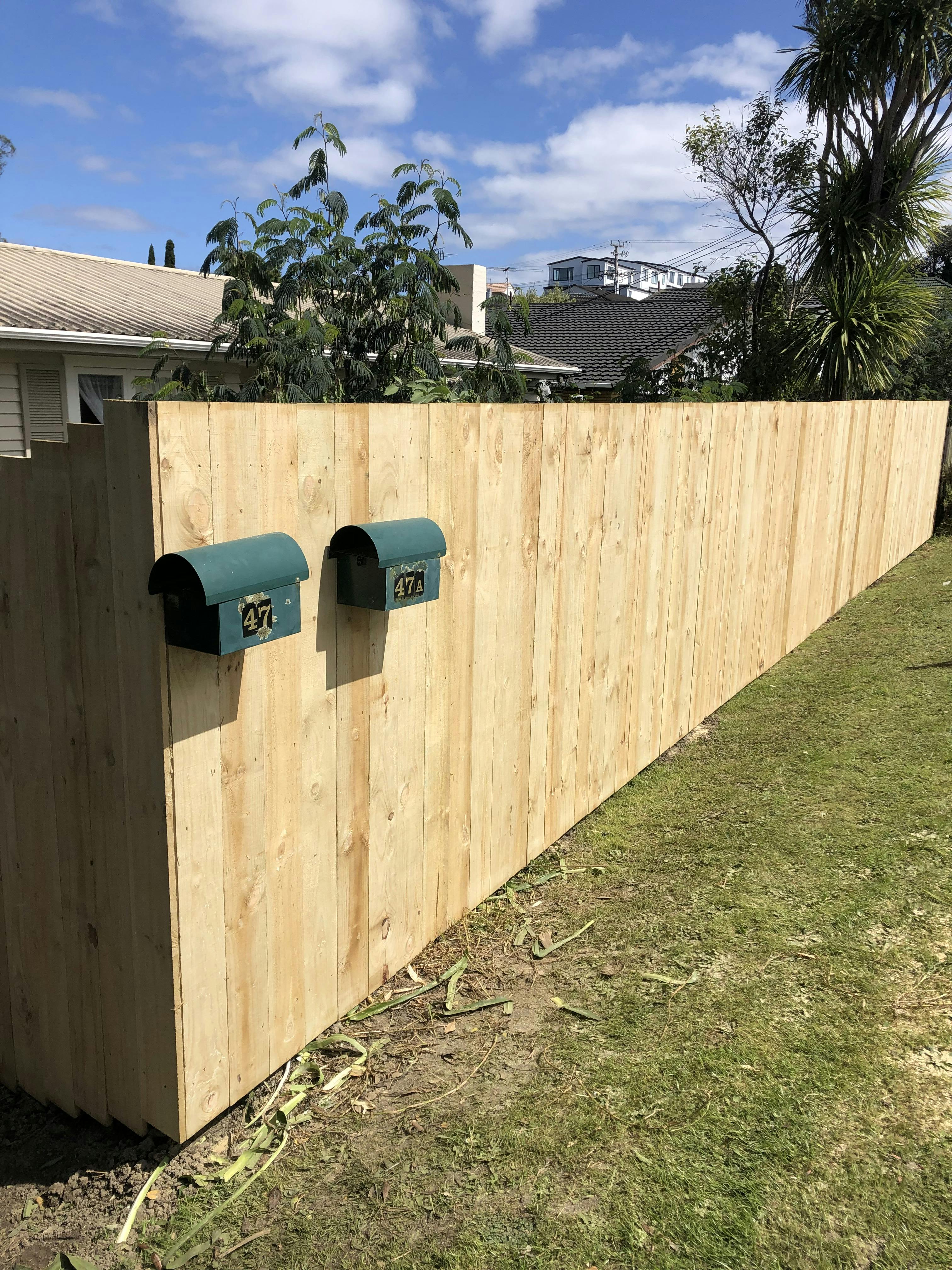 old fence teared down and rebuilt built for a small home in auckland